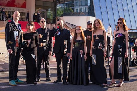 Ukrainian team of Cannes Directors’ Fortnight title ‘Militantropos’ make red carpet action, statement about ongoing war with Russia