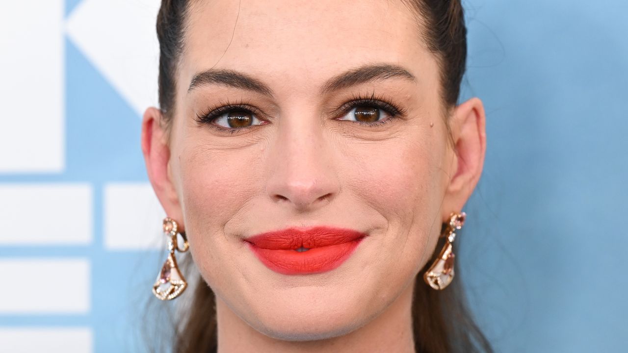 Anne Hathaway Proudly Shows Off Her Baby Bump at The End of Oak Street Premiere Anne Hathaway Proudly Shows Off Her Baby Bump at The End of Oak Street Premiere